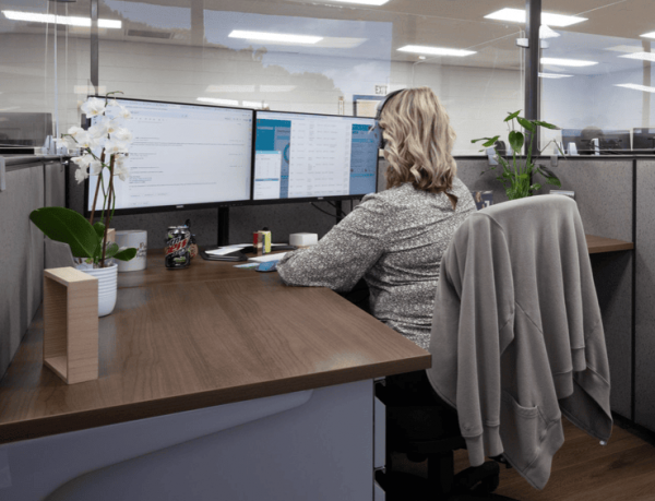 Woman working at Freeman health partners checks insurance for mental health coverage