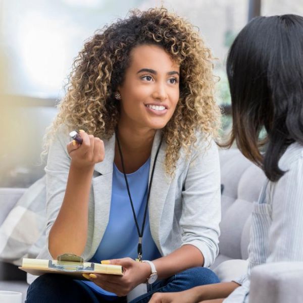 Two women having a conversation about how to find a PCP.