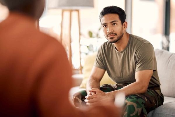 A veteran discusses tricare rehab in Nashville with his therapist.