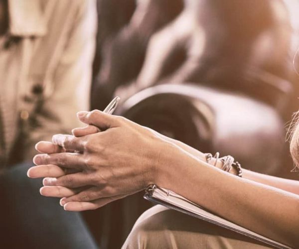 Professional conducting a mental health screening in conversation with patient before suggesting the best path for depression treatment in Nashville