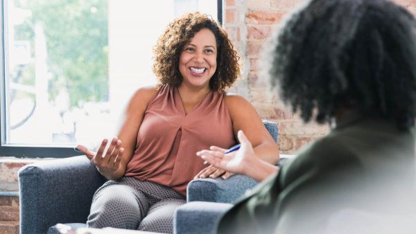 Two women having a conversation about how to find a PCP.