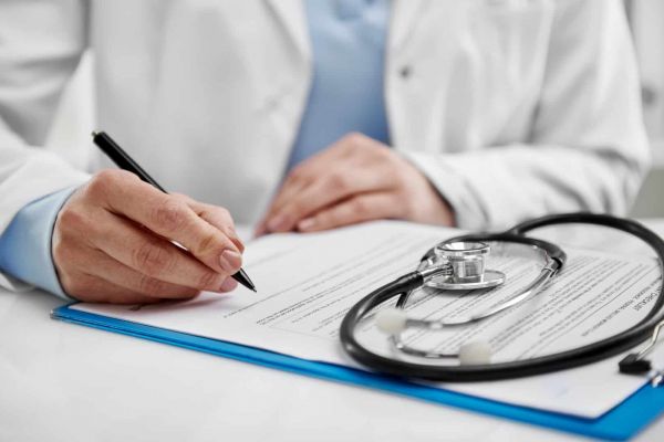 A medical professional fills out paperwork for Humana healthcare in Nashville.