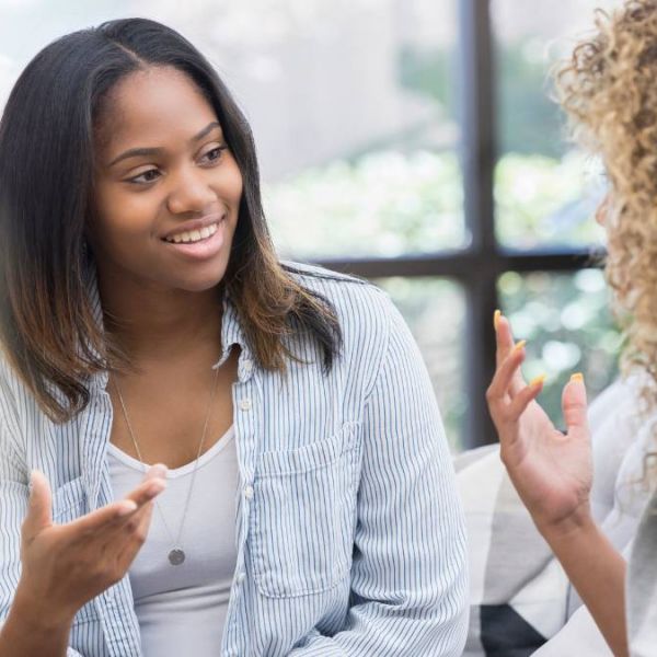 A woman during a meet-and-greet appointment discussing with an expert how to find a PCP that best meets her needs.