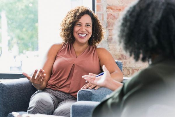 Two women having a conversation about how to find a PCP.