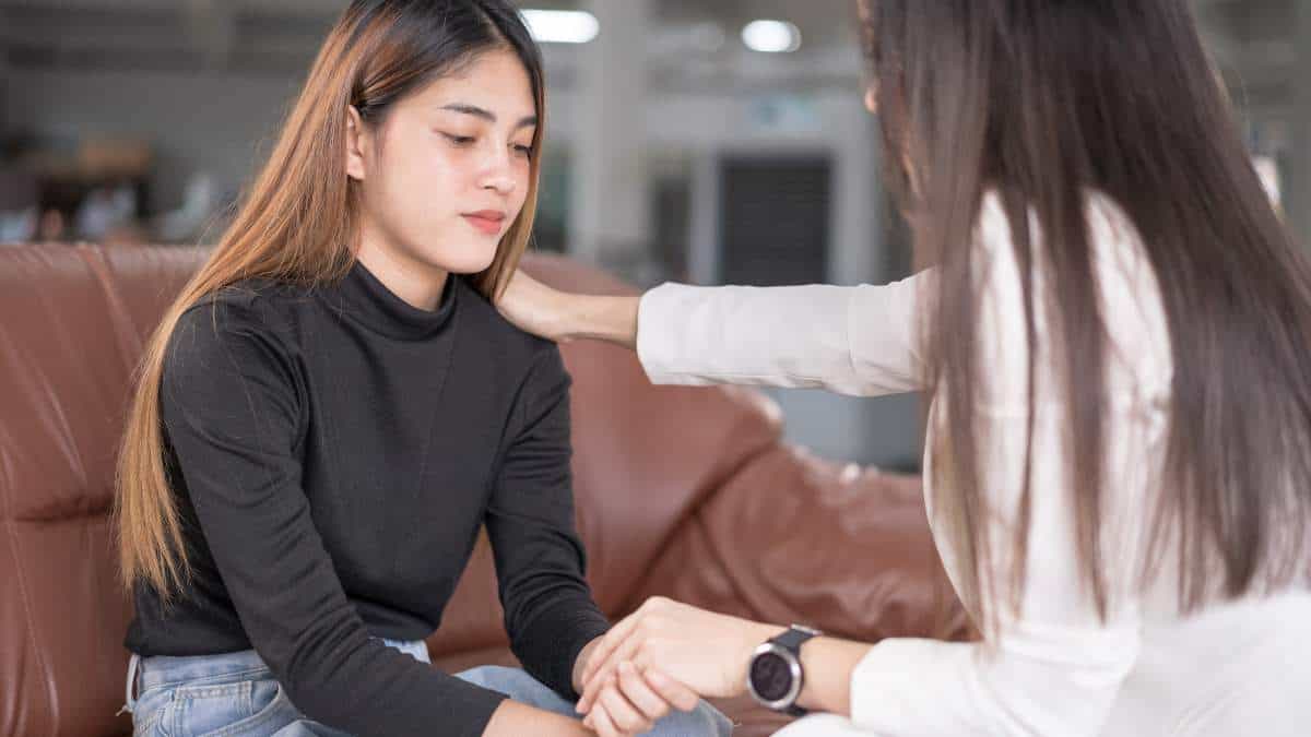 Young female patient getting support from therapist during depression treatment in Nashville.
