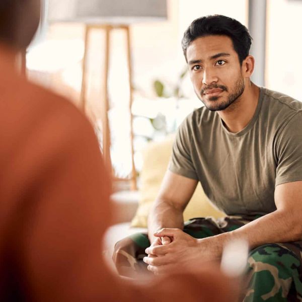 A veteran discusses tricare rehab in Nashville with his therapist.