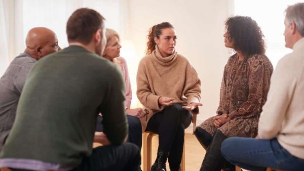 Group of people meeting at an addiction treatment center to discuss outpatient detox in Nashville.