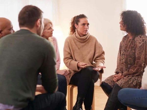 Group of people meeting at an addiction treatment center to discuss outpatient detox in Nashville.