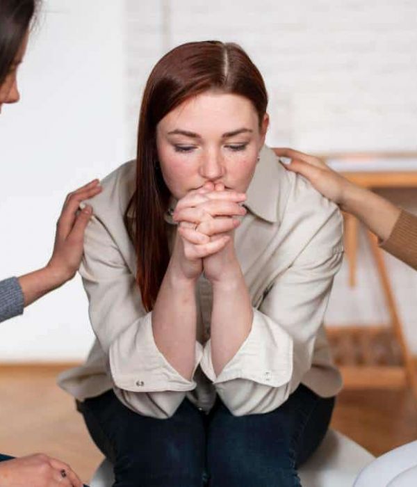 A group of close friends offering compassionate support to a friend facing mental health challenges, a powerful way of how to help someone struggling with mental health.