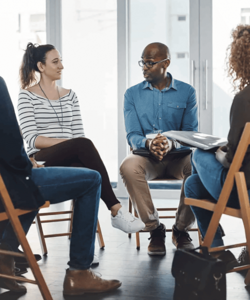 Group of people meeting at an addiction treatment center to discuss outpatient detox in Nashville.