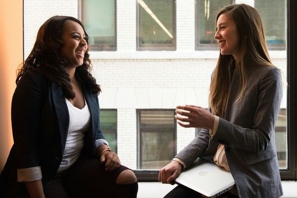 two women discuss mental health as they live happy in recovery