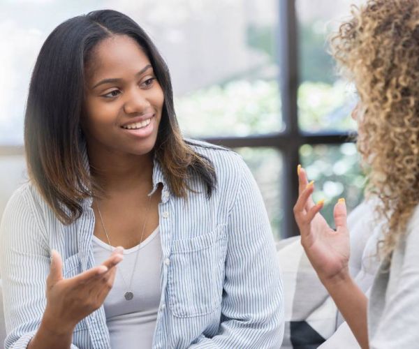 A woman during a meet-and-greet appointment discussing with an expert how to find a PCP that best meets her needs.