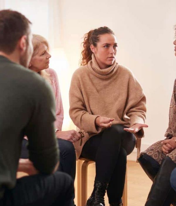 Group of people meeting at an addiction treatment center to discuss outpatient detox in Nashville.