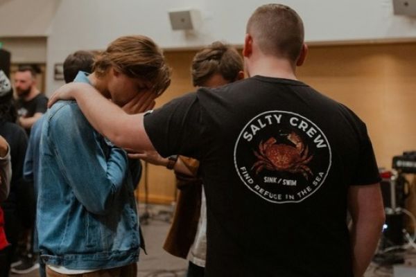 Men supporting each other as they recover from mental health