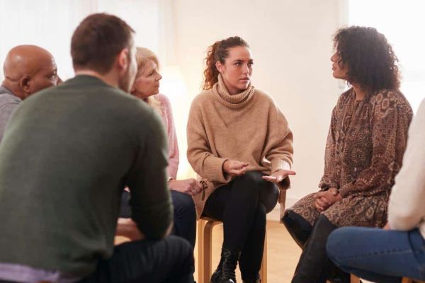 Group of people meeting at an addiction treatment center to discuss outpatient detox in Nashville.