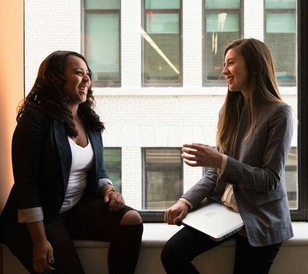 two women discuss mental health as they live happy in recovery