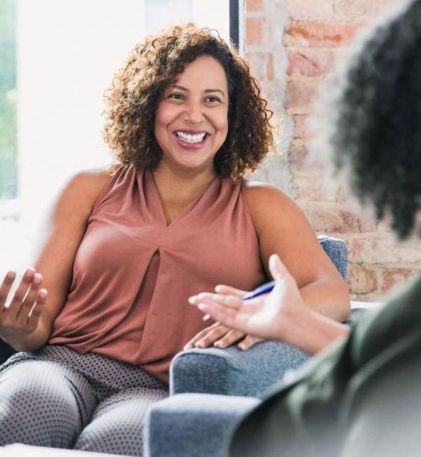 Two women having a conversation about how to find a PCP.