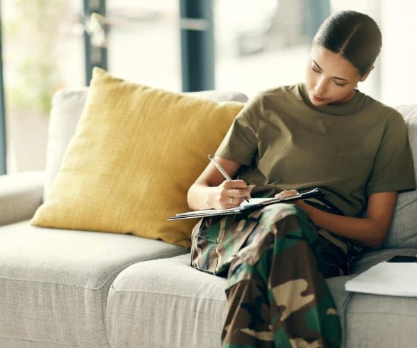 veteran completes form for TRICARE insurance