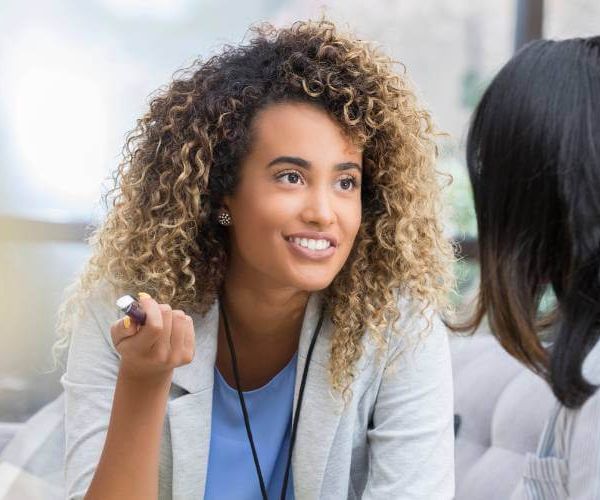 woman doctor speaks to her patient about mental health treatment options