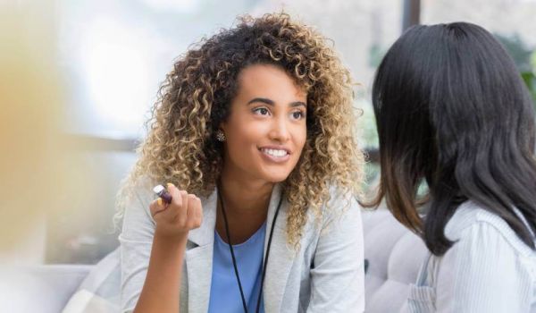 woman doctor speaks to her patient about mental health treatment options