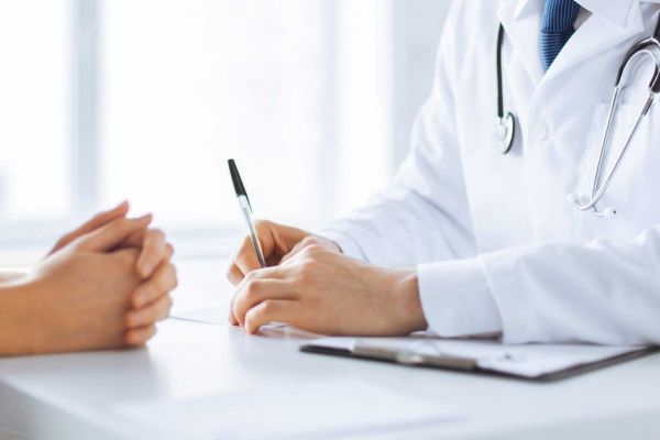 outpatient rehab doctor and patient