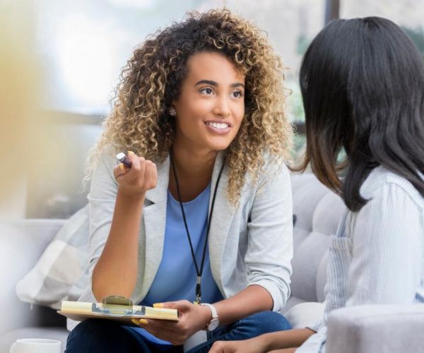 Two women having a conversation about how to find a PCP.